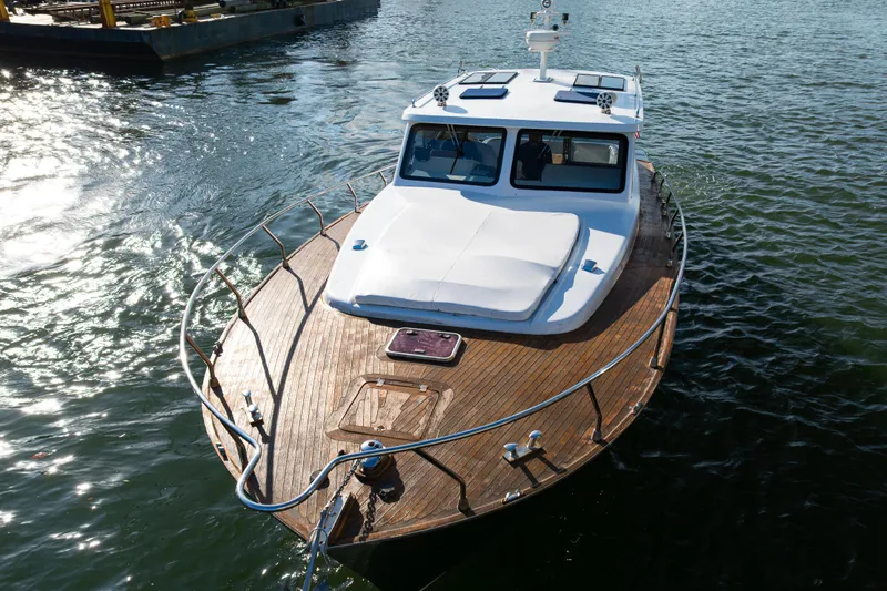 Slide: The Image of Custom NNS Sea Scout 41 boat, 2007 model, on water with wooden deck. - 5