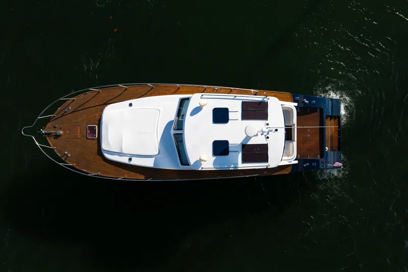 Slide: The Image of Aerial view of 2007 Custom NNS Sea Scout 41 yacht cruising on water. - 9