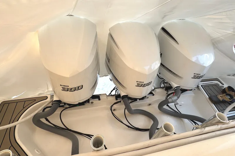 Slide: The Image of Triple Yamaha 300 engines on a 2019 Pursuit OS 385 Offshore boat. - 20