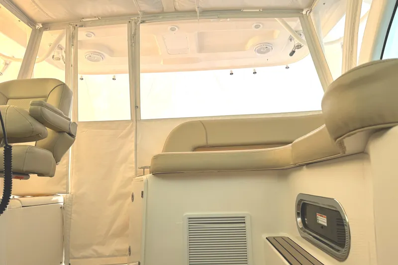 Slide: The Image of Interior of 2019 Pursuit OS 385 Offshore boat with beige seating and modern design. - 25