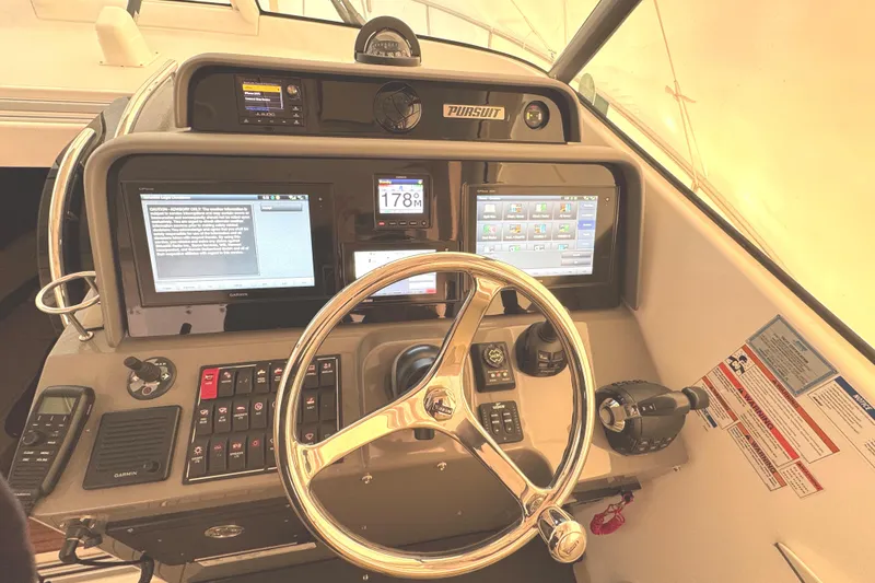 Slide: The Image of 2019 Pursuit OS 385 Offshore helm with advanced navigation systems. - 3