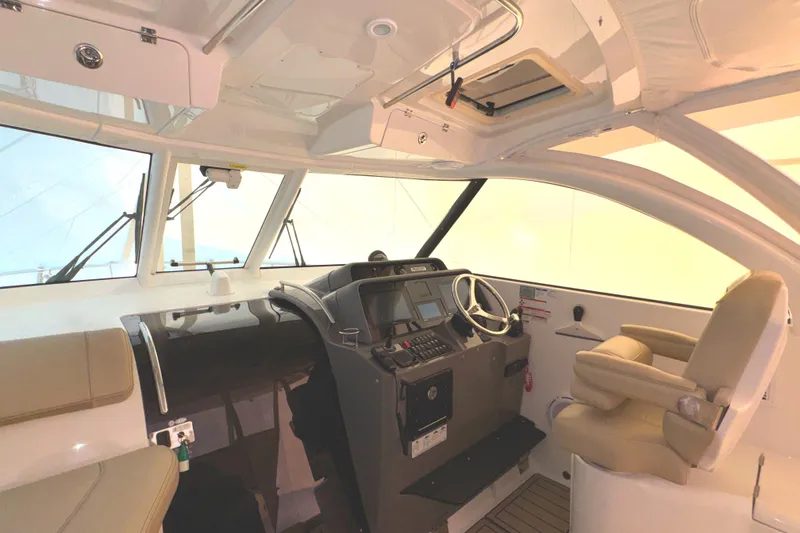 Slide: The Image of 2019 Pursuit OS 385 Offshore helm with modern controls and comfortable seating. - 30