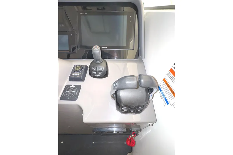 Slide: The Image of 2019 Pursuit OS 385 Offshore helm with Garmin display and Yamaha controls. - 32