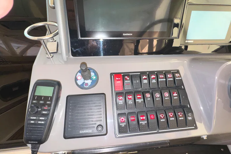 Slide: The Image of Control panel of a 2019 Pursuit OS 385 Offshore boat with Garmin electronics. - 33