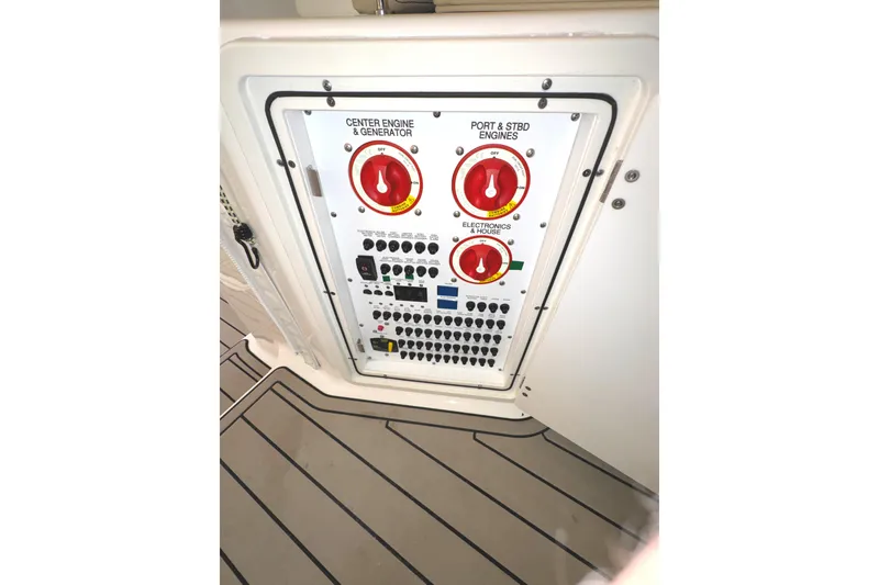 Slide: The Image of Control panel of 2019 Pursuit OS 385 Offshore boat with switches and dials. - 35