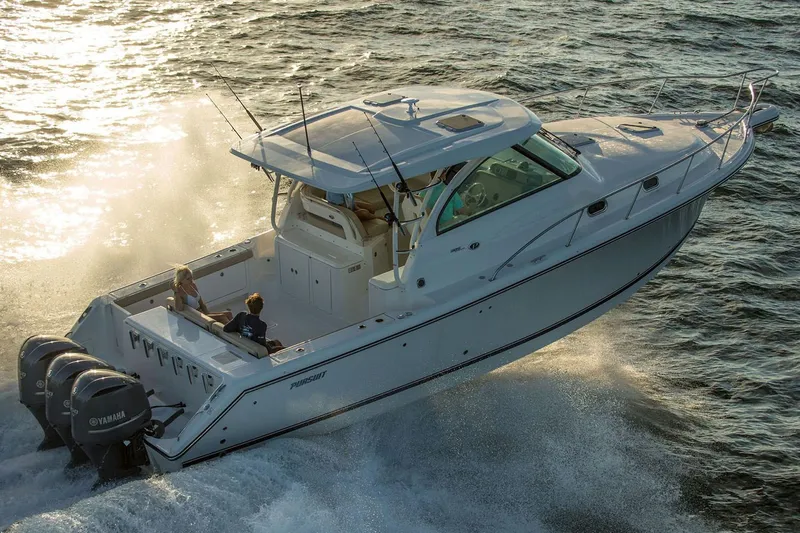 Slide: The Image of Manufacturer Provided Image: 2019 Pursuit OS 385 Offshore boat cruising on water. - 41
