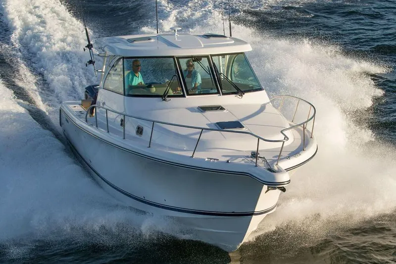 Slide: The Image of Manufacturer Provided Image: 2019 Pursuit OS 385 Offshore boat cruising on water. - 45