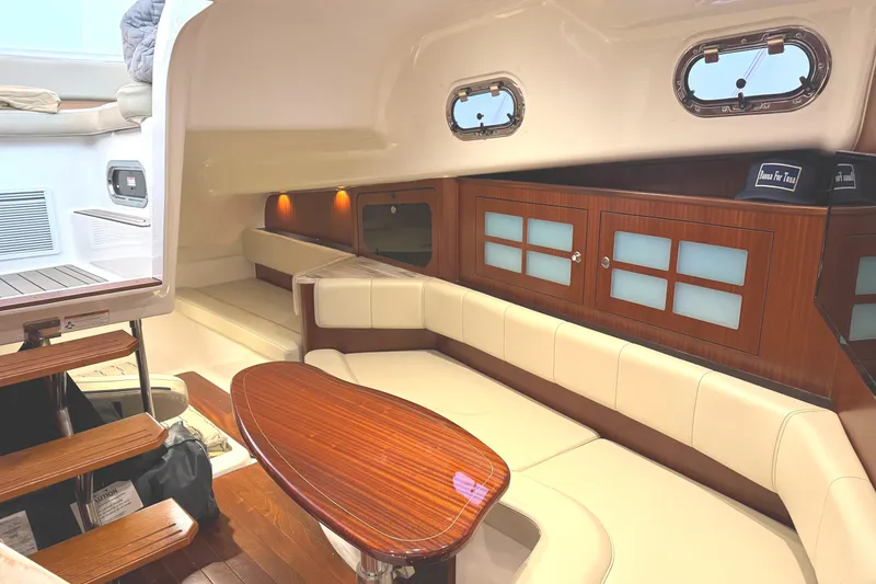 Slide: The Image of Luxurious interior of 2019 Pursuit OS 385 Offshore boat with elegant seating and wooden accents. - 5