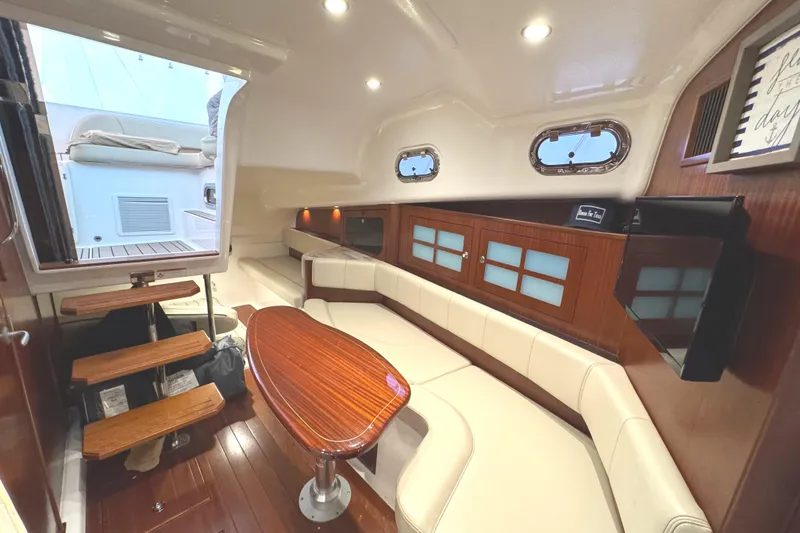 Slide: The Image of Luxurious interior of 2019 Pursuit OS 385 Offshore boat with elegant seating and wooden accents. - 9