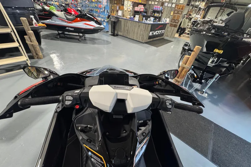 Slide: The Image of Interior view of 2026 Kawasaki ULTRA 160LX-S jet ski in showroom. - 10