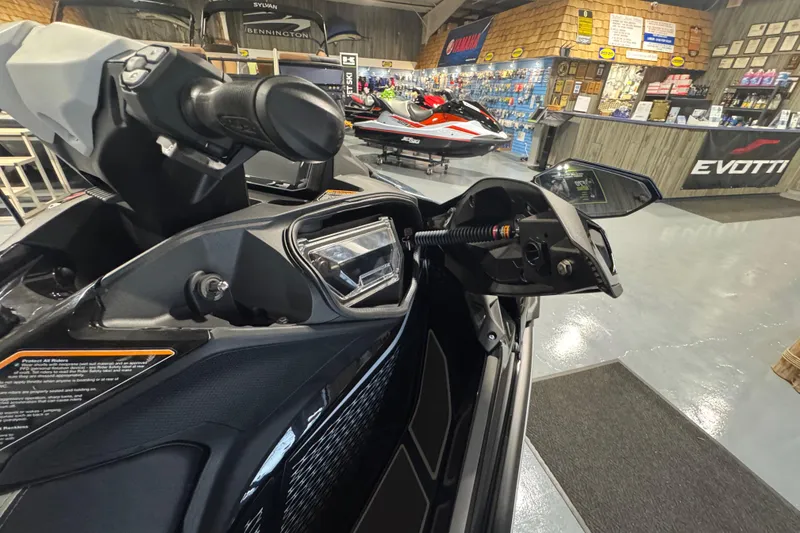 Slide: The Image of 2026 Kawasaki ULTRA 160LX-S jet ski in showroom, featuring sleek design and advanced controls. - 8