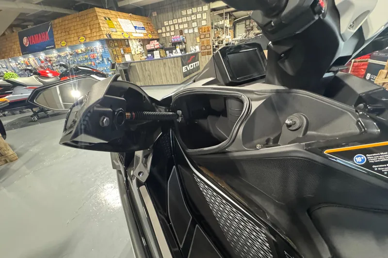 Slide: The Image of 2026 Kawasaki ULTRA 160LX-S jet ski on display in a showroom. - 9