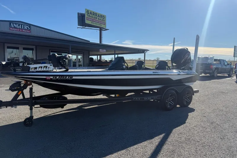 Slide: The Image of 2024 Skeeter ZXR19 boat on trailer outside Anglers Outpost & Marine dealership. - 3