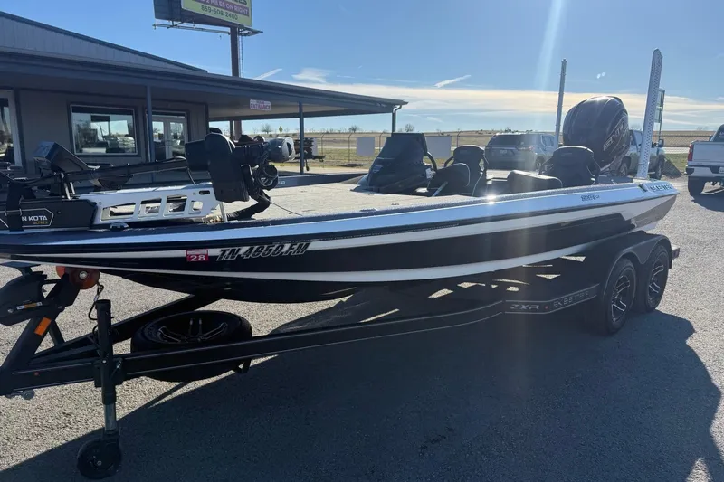 Slide: The Image of 2024 Skeeter ZXR19 boat on trailer in dealership parking lot. - 4