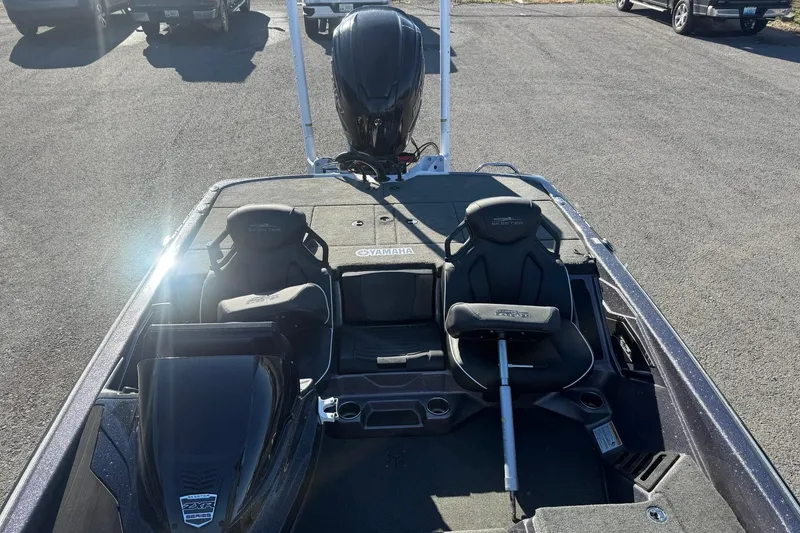 Slide: The Image of 2024 Skeeter ZXR19 boat interior with Yamaha engine, featuring dual seats and steering console. - 7