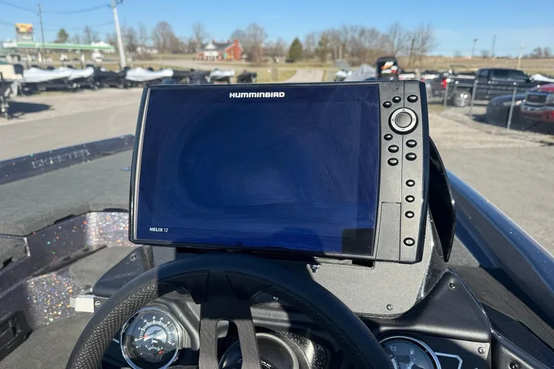 Slide: The Image of 2024 Skeeter ZXR19 boat dashboard with Humminbird Helix 12 fishfinder display. - 8