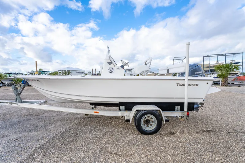 Slide: The Image of 2013 Tidewater 1900 Bay Max boat on trailer under blue sky. - 10