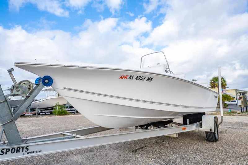 Slide: The Image of 2013 Tidewater 1900 Bay Max boat on trailer under cloudy sky. - 11