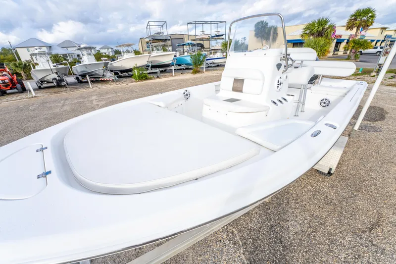 Slide: The Image of 2013 Tidewater 1900 Bay Max boat in a marina with other vessels. - 13