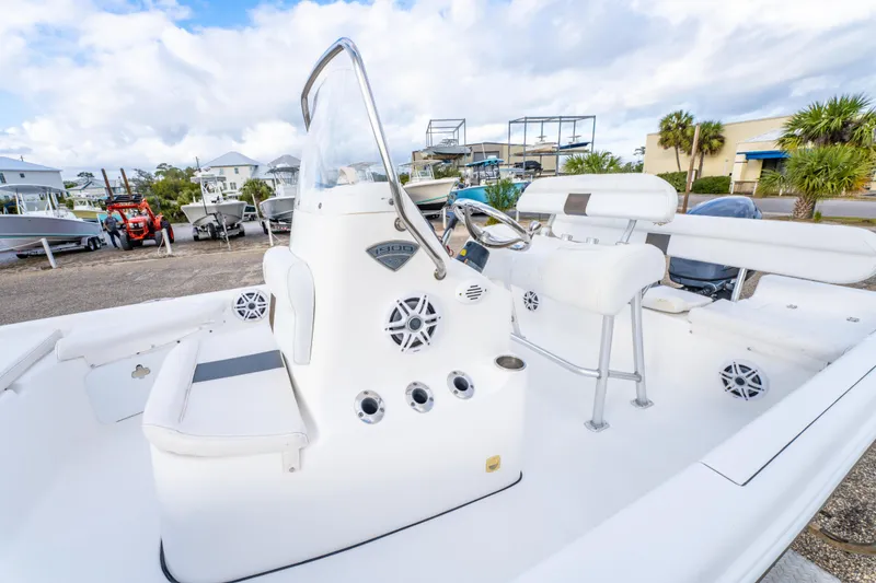 Slide: The Image of 2013 Tidewater 1900 Bay Max boat interior with steering console and seating. - 18