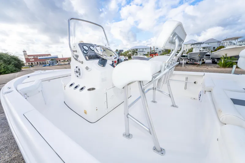Slide: The Image of 2013 Tidewater 1900 Bay Max boat interior with steering console and seating. - 19