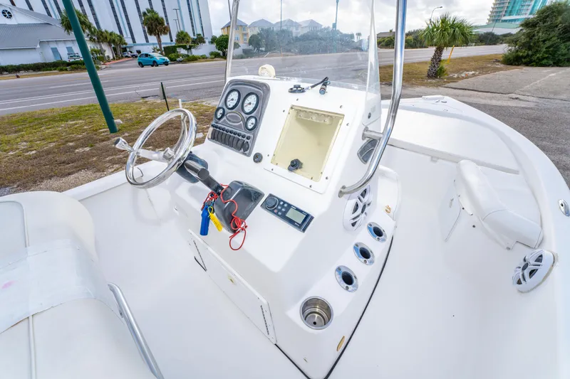 Slide: The Image of 2013 Tidewater 1900 Bay Max boat interior with steering wheel and control panel. - 22