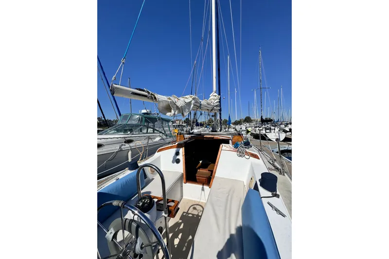 Slide: The Image of Engine of a 1980 Catalina 30 sailboat, showcasing mechanical components. - 16