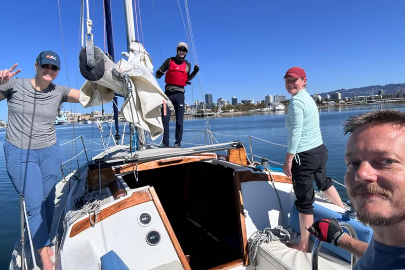 Slide: The Image of 1980 Catalina 30 sailboat in dry dock, marina background, clear blue sky. - 19