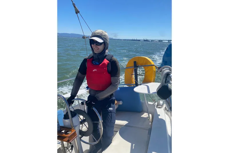 Slide: The Image of Man on 1980 Catalina 30 sailboat in marina, sunny day, wearing sunglasses. - 20