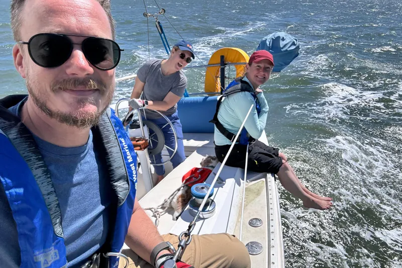 Slide: The Image of Dog on 1980 Catalina 30 sailboat deck, near calm water and residential area. - 21