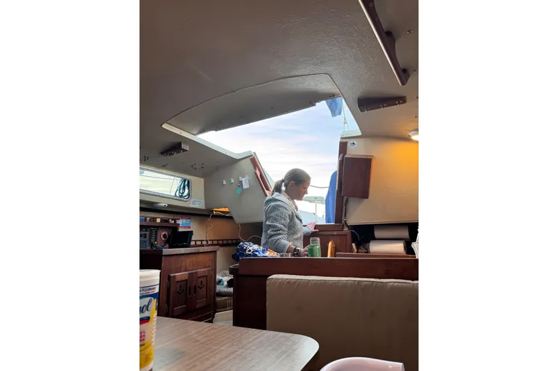 Slide: The Image of Battery compartment of a 1980 Catalina 30 sailboat with wiring connections. - 27