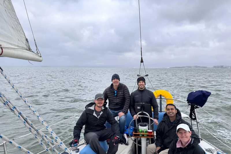 Slide: The Image of 1980 Catalina 30 sailboat docked under clear blue sky. - 32