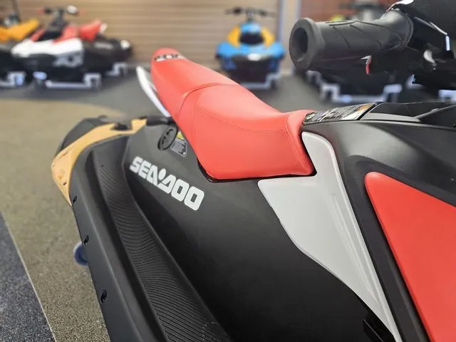 Slide: The Image of 2026 Sea-Doo Spark for 3, red seat, close-up in showroom. - 12