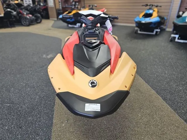 Slide: The Image of 2026 Sea-Doo Spark for 3, red and yellow, in showroom. - 3