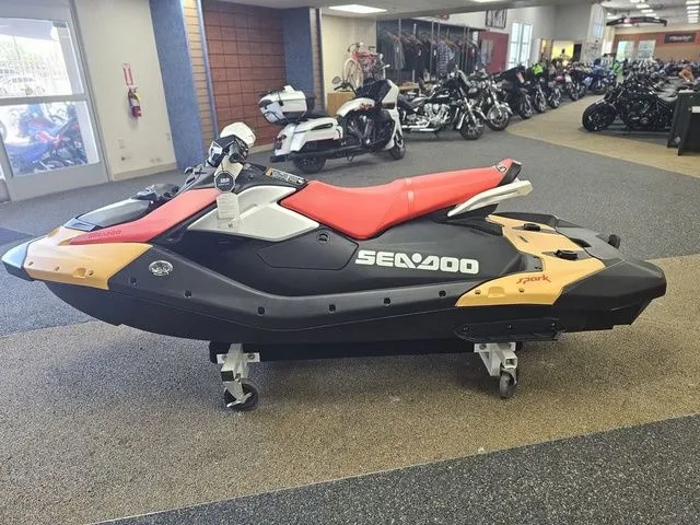 Slide: The Image of 2026 Sea-Doo Spark for 3 in showroom, black and red. - 5