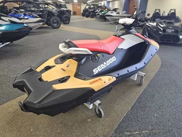 Slide: The Image of 2026 Sea-Doo Spark for 3, red and black, in showroom. - 8