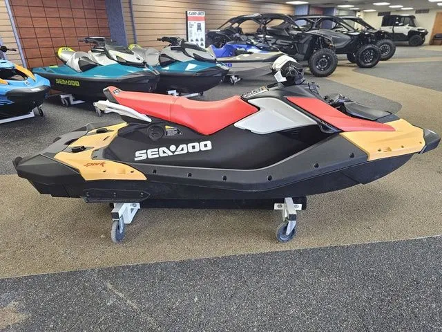 Slide: The Image of 2026 Sea-Doo Spark for 3, black and red, in a showroom. - 9