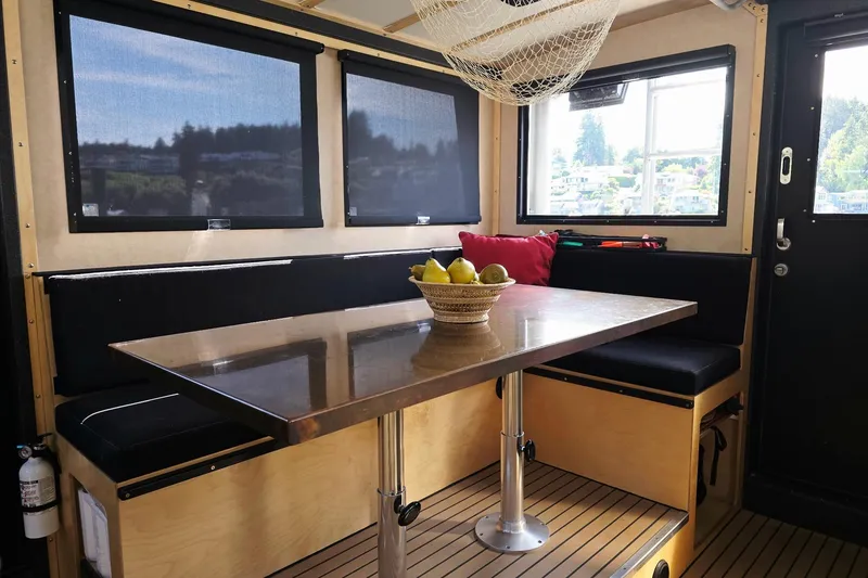 Slide: The Image of Interior of 2020 Armstrong Marine 35 boat with dining area and fruit basket. - 107