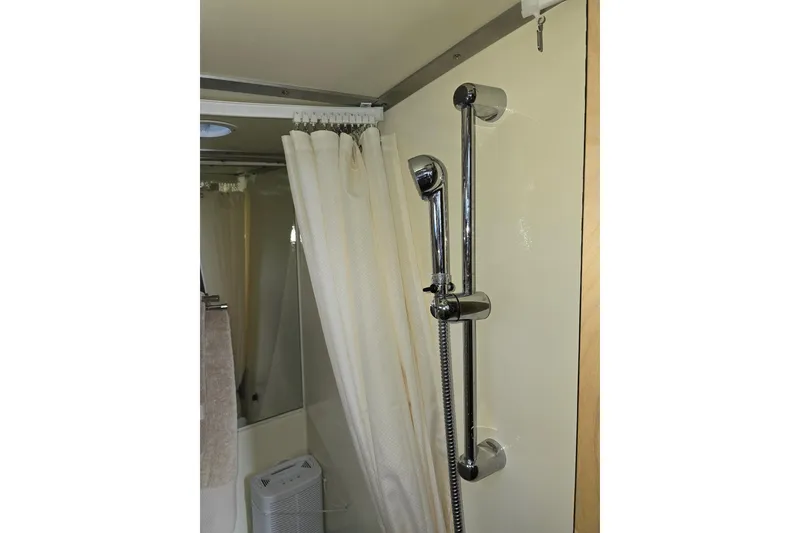 Slide: The Image of Shower area in 2020 Armstrong Marine 35 boat with chrome fixtures and curtain. - 109