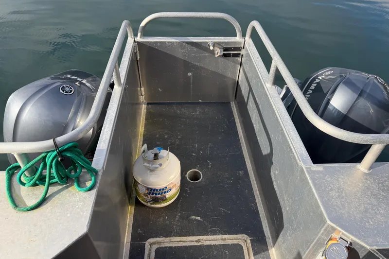 Slide: The Image of Outboard motor on Armstrong Marine 35 boat, 2020 model, with coiled rope. - 11