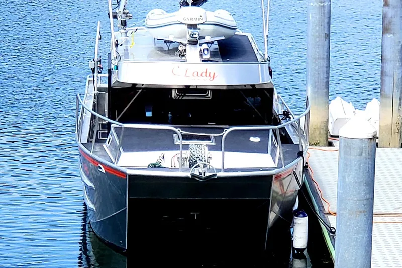 Slide: The Image of 2020 Armstrong Marine 35 boat docked at marina with calm water. - 114