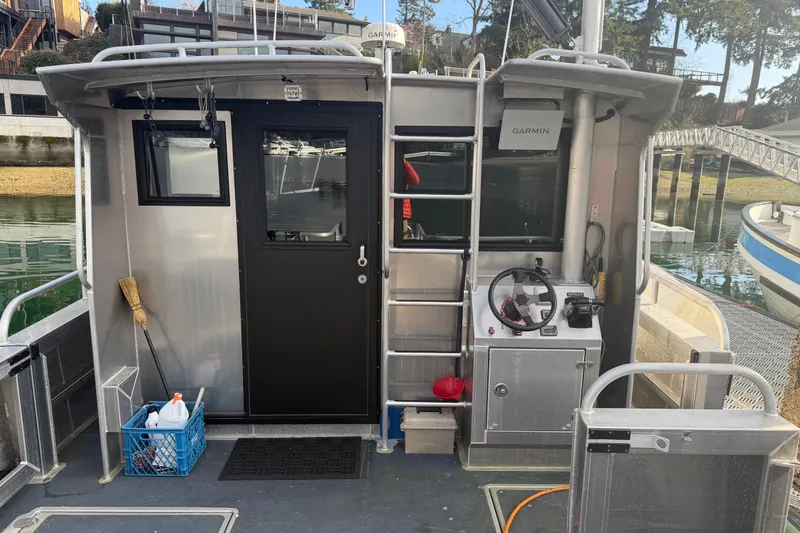 Slide: The Image of 2020 Armstrong Marine 35 boat deck with storage compartments and safety equipment. - 16