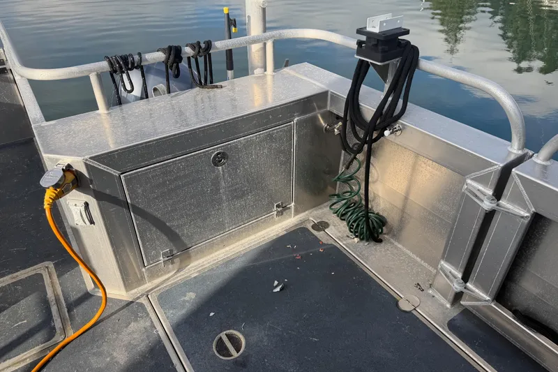 Slide: The Image of Armstrong Marine 35 boat deck, 2020 model, with storage compartment and coiled ropes. - 17