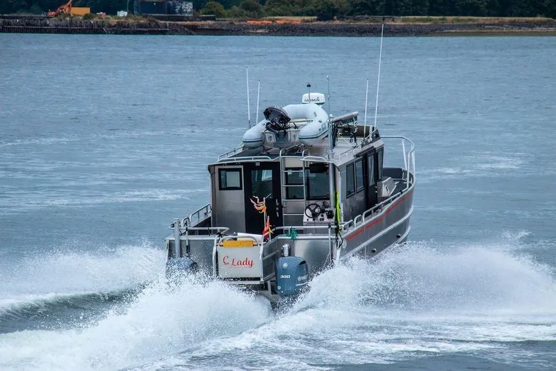 Slide: The Image of Armstrong Marine 35 boat docked at marina, 2020 model, with overcast sky. - 2