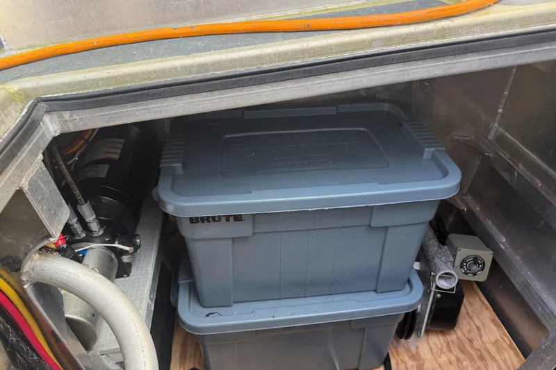 Slide: The Image of Electrical compartment of a 2020 Armstrong Marine 35 boat with wiring and maintenance supplies. - 25