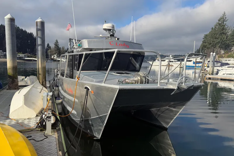 Slide: The Image of 2020 Armstrong Marine 35 boat docked in a marina, featuring a sturdy metal design. - 3