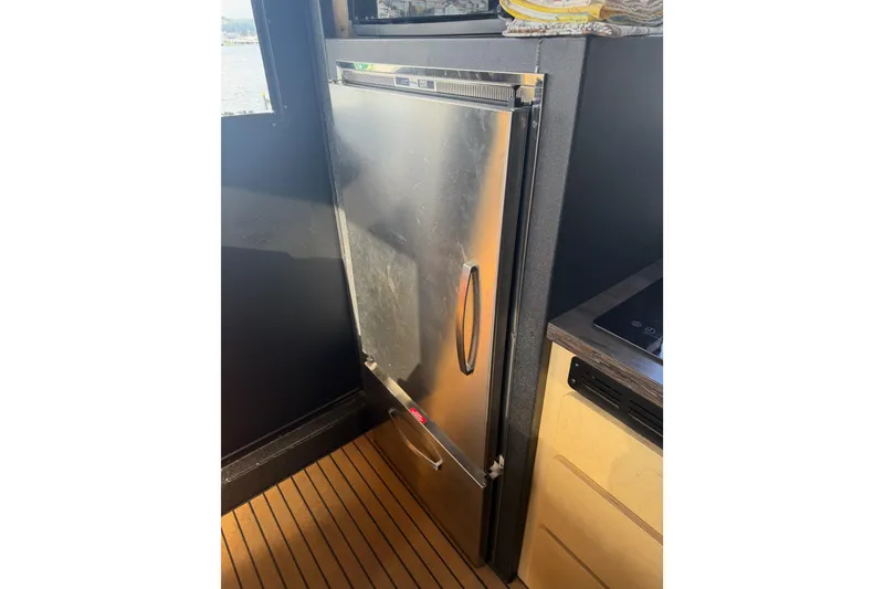 Slide: The Image of Compact bathroom in a 2020 Armstrong Marine 35 boat, featuring a toilet and sink. - 45