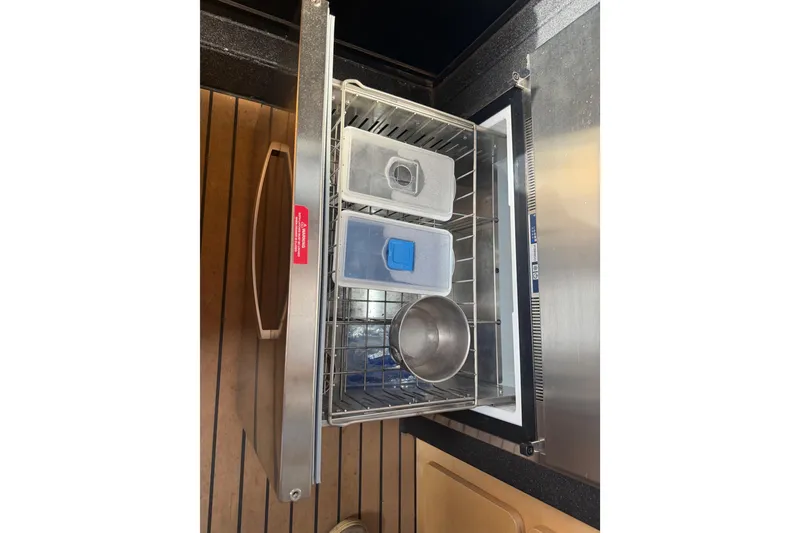 Slide: The Image of 2020 Armstrong Marine 35 interior bathroom with sink, mirror, and compact design. - 47