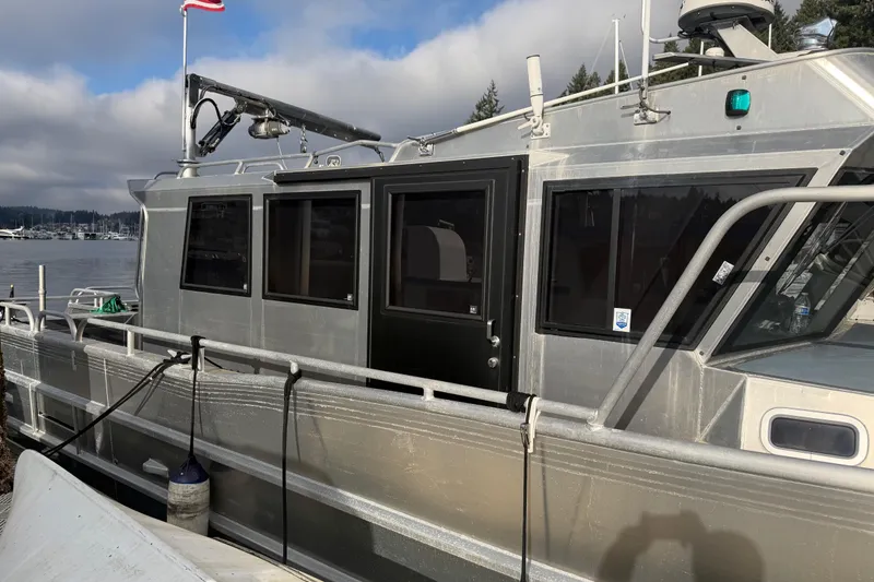 Slide: The Image of 2020 Armstrong Marine 35 boat docked, featuring a sleek design and modern cabin. - 5