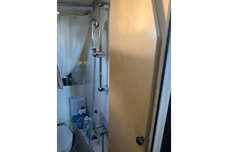 Slide: The Image of Interior of 2020 Armstrong Marine 35 boat with wooden cabinetry and storage space. - 51